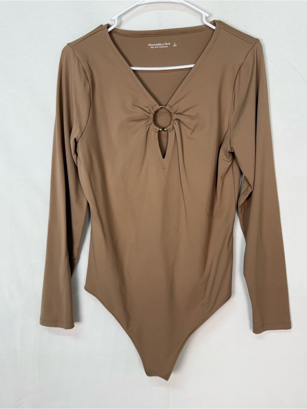 Abercrombie & Fitch Ring-Detail V-Neck Long Sleeve Bodysuit in Tan/Brown
